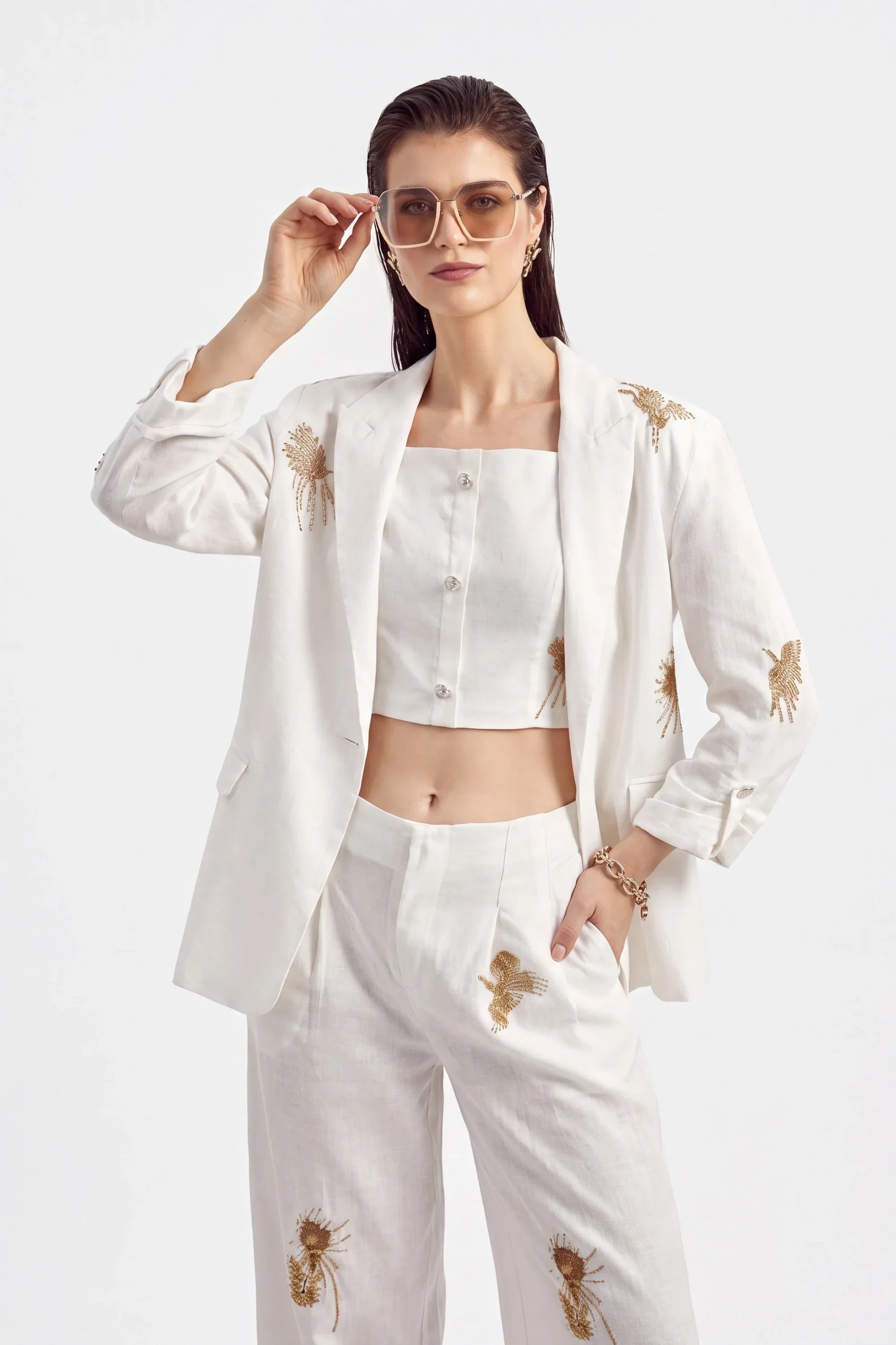 Embroidered Bottoms wholesale collection featuring White Polyester Wide-Leg Pants with Gold Crane Embroidery