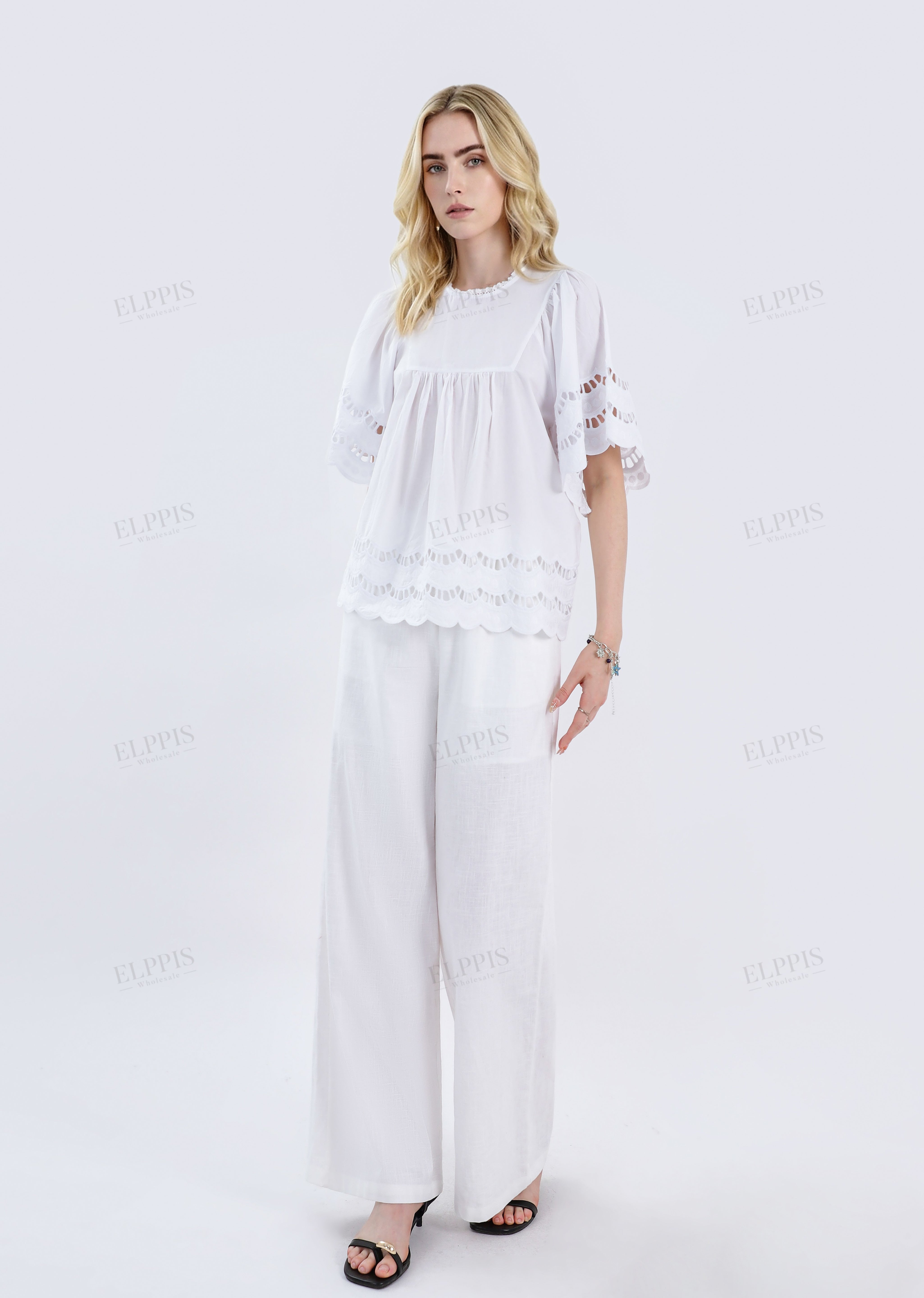 White Short-Sleeve Blouse with Cutwork Embroidery & Ruffled Hem