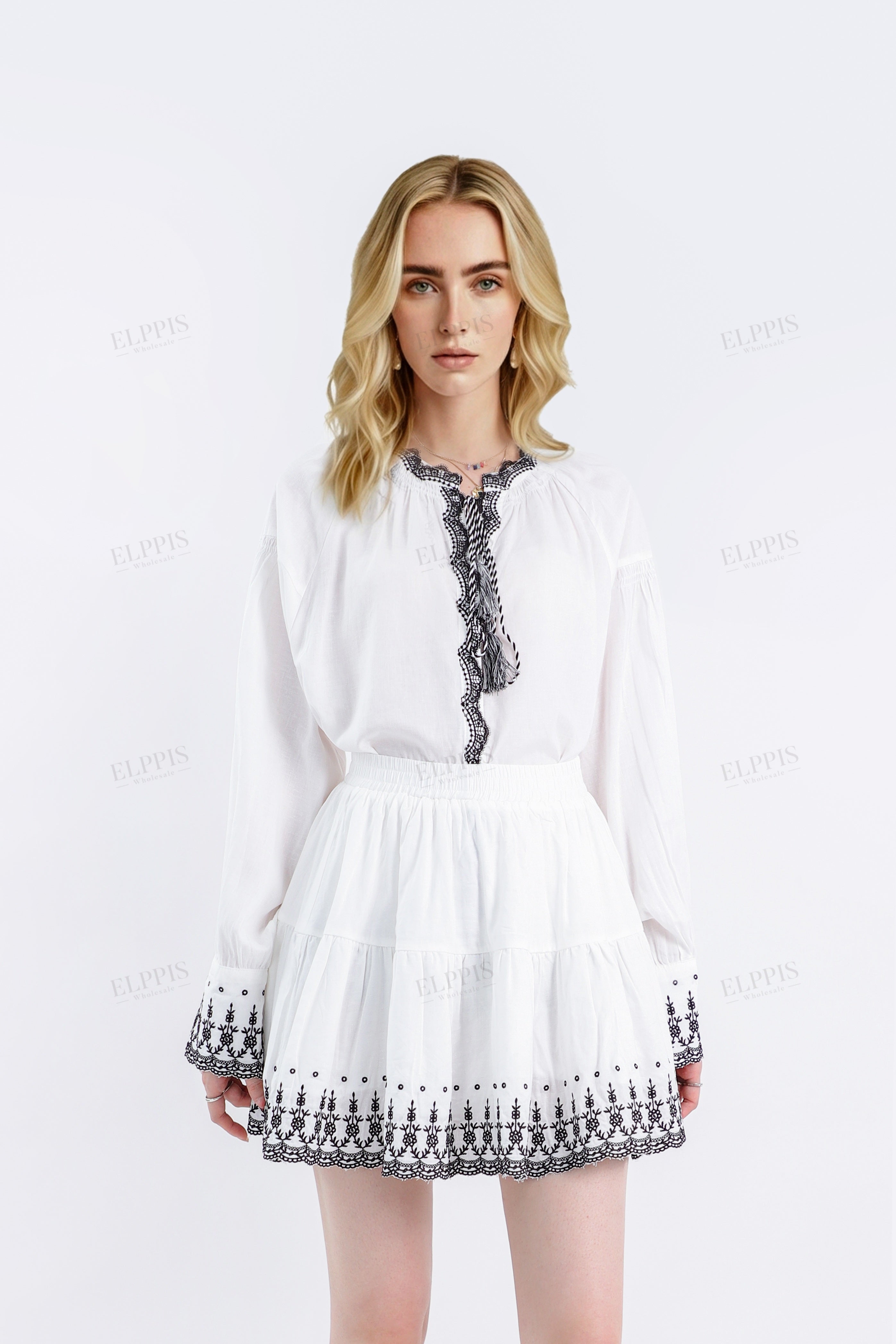 White Linen Blouse with Black Embroidered Trim & Tassel Detail
