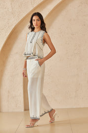 Cream Sleeveless Top with Black Embroidered Trim