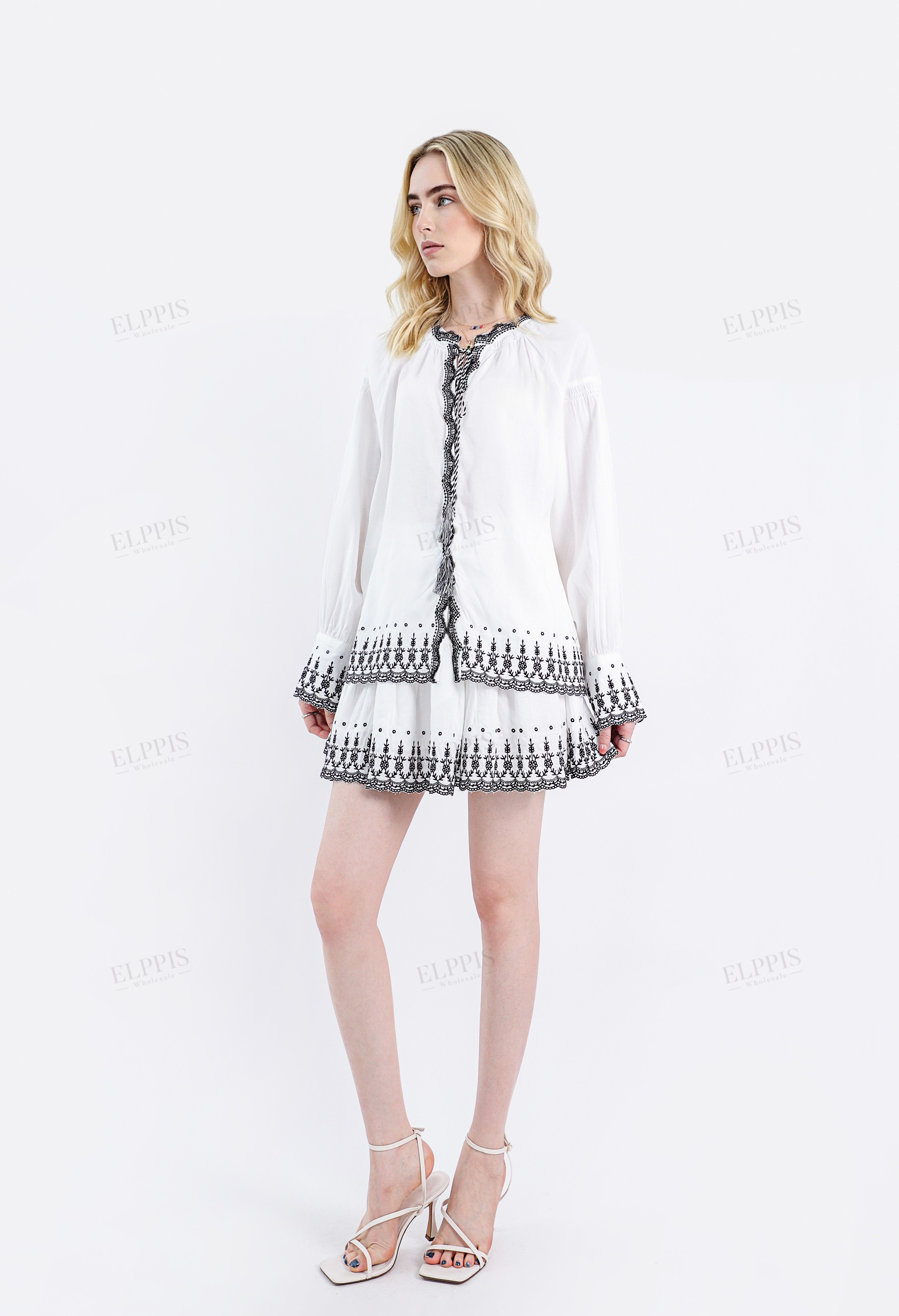 White Linen Blouse with Black Embroidered Trim & Tassel Detail