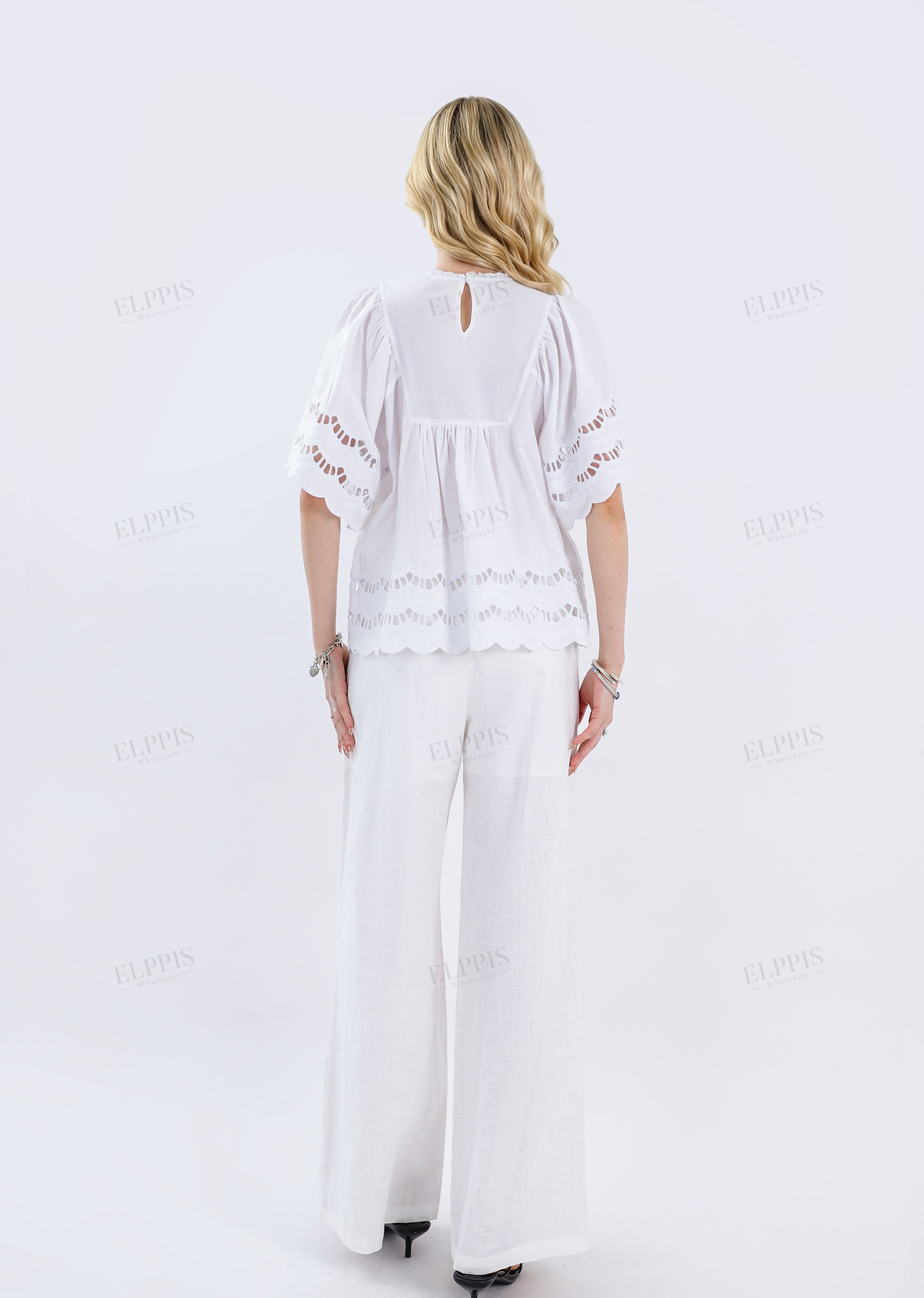 White Short-Sleeve Blouse with Cutwork Embroidery & Ruffled Hem