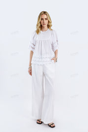 White Short-Sleeve Blouse with Cutwork Embroidery & Ruffled Hem