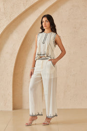 Cream Sleeveless Top with Black Embroidered Trim