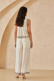 Cream Sleeveless Top with Black Embroidered Trim