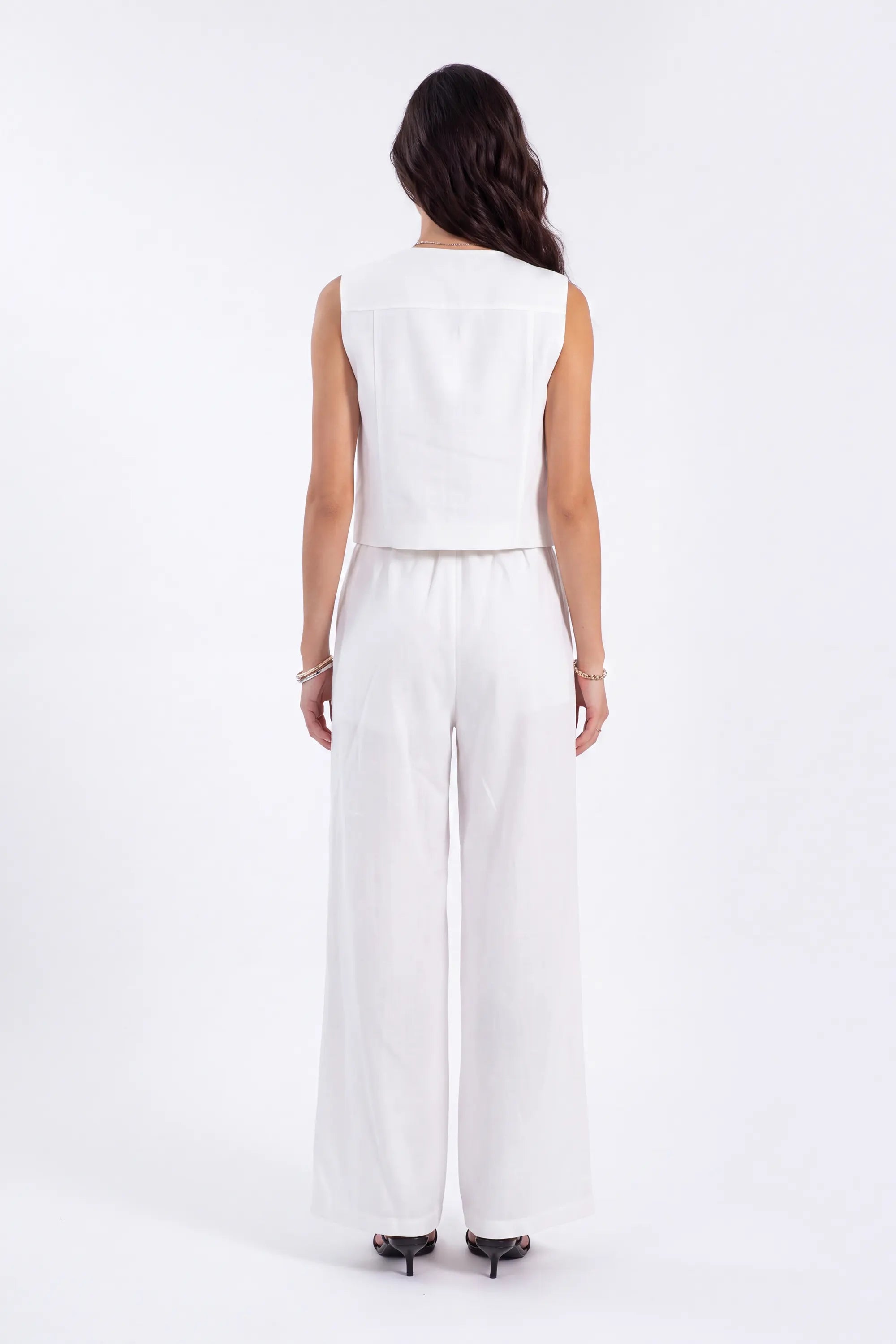 White Cropped Vest with Floral Cutwork Embroidery and Pearl Buttons on model, back view – Elppis 1B5D07501WW-01CM