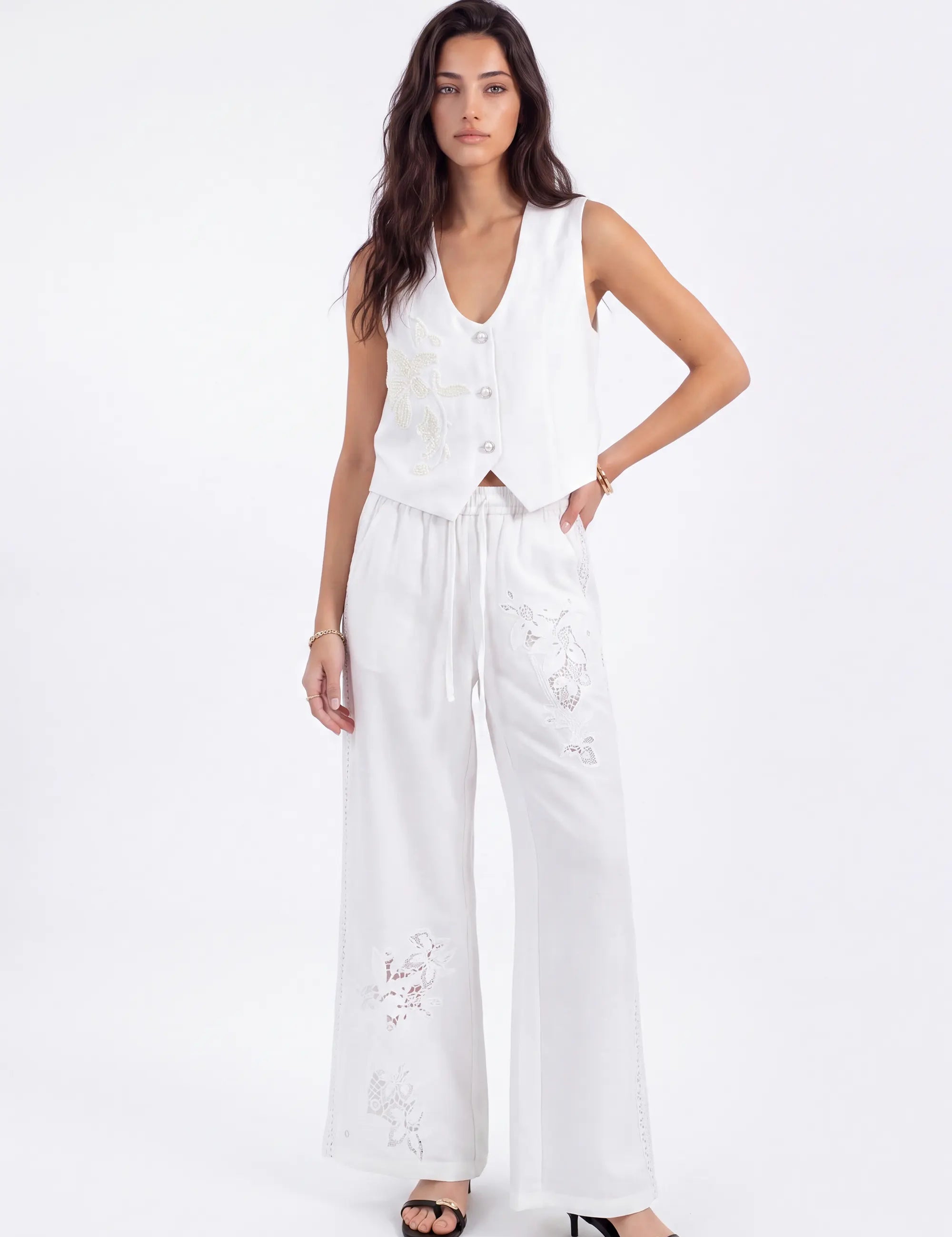 White Cropped Vest with Floral Cutwork Embroidery and Pearl Buttons on model, front view – Elppis 1B5D07501WW-01CM