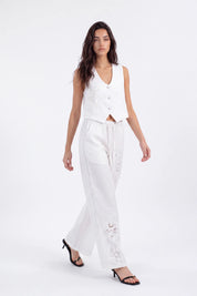 White Cropped Vest with Floral Cutwork Embroidery and Pearl Buttons on model, studio view 2 – Elppis 1B5D07501WW-01CM