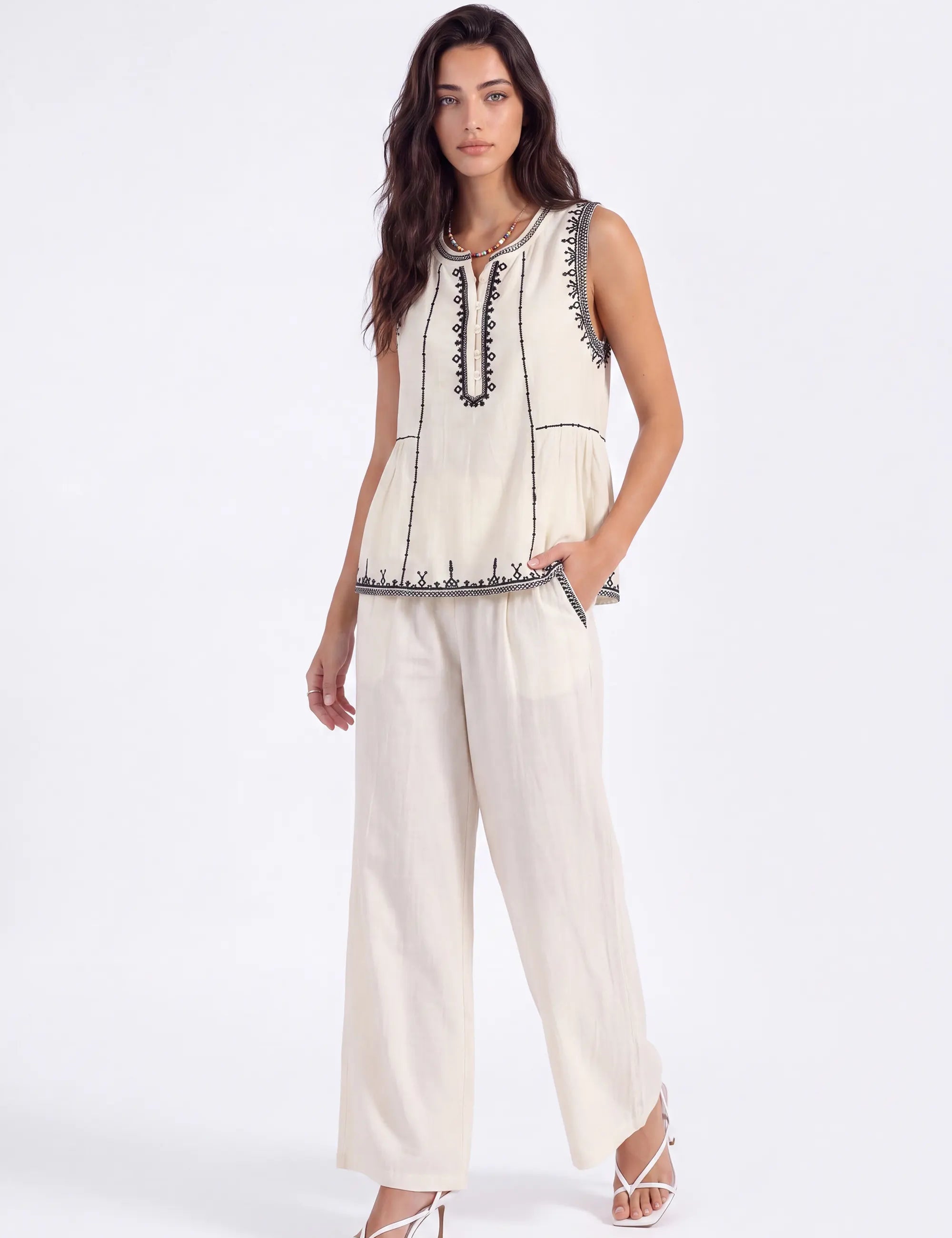 Cream Sleeveless Top with Black Embroidered Trim on model, studio view 2 – Elppis 1B5E08923WW