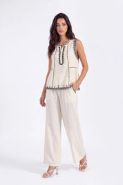 Cream Sleeveless Top with Black Embroidered Trim on model, studio view 2 – Elppis 1B5E08923WW
