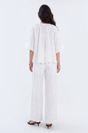 White Blouse with Crochet Lace Accents and Bell Sleeves on model, back view – Elppis 1B5E09168WW-01CM