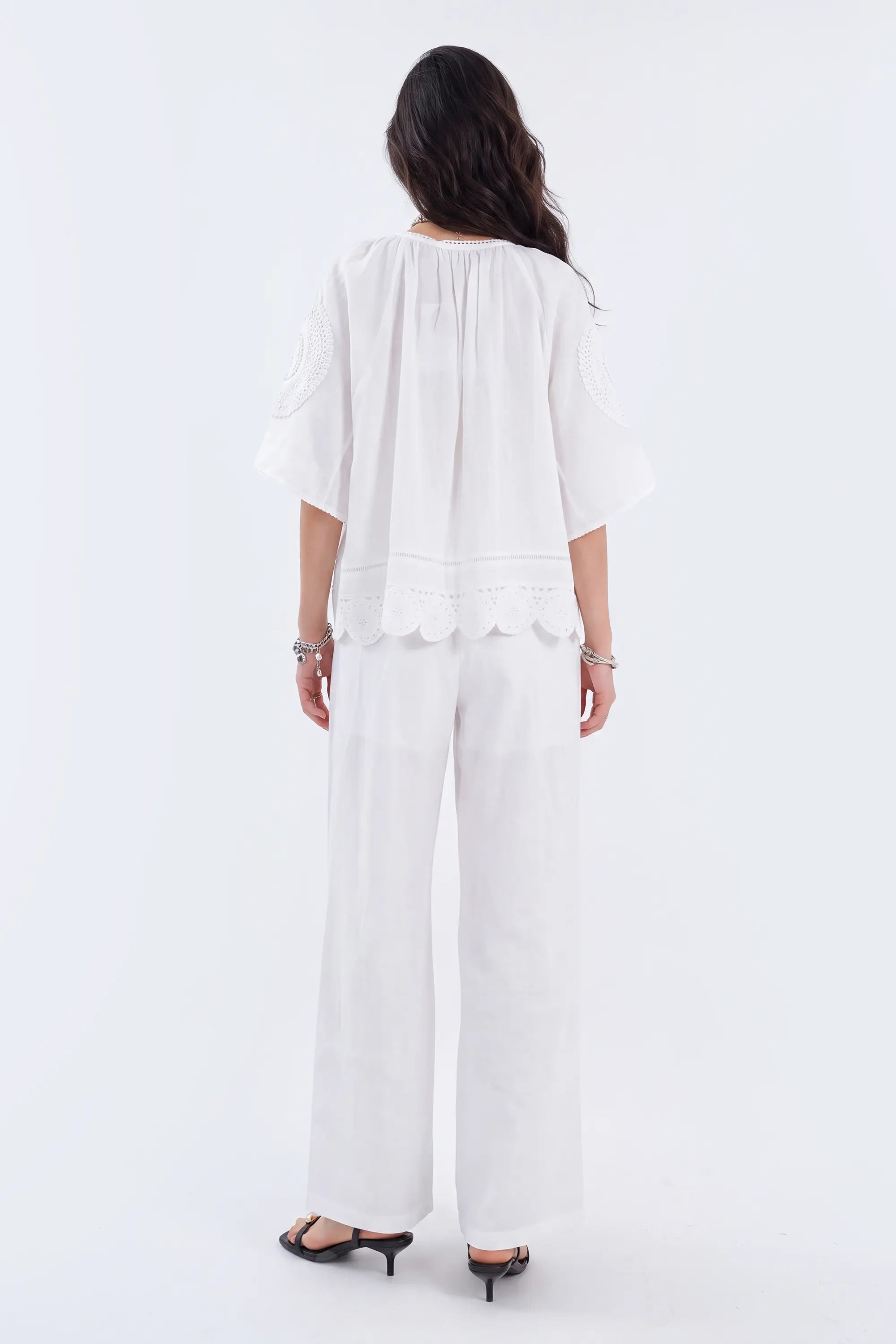 White Blouse with Crochet Lace Accents and Bell Sleeves on model, back view – Elppis 1B5E09168WW-01CM