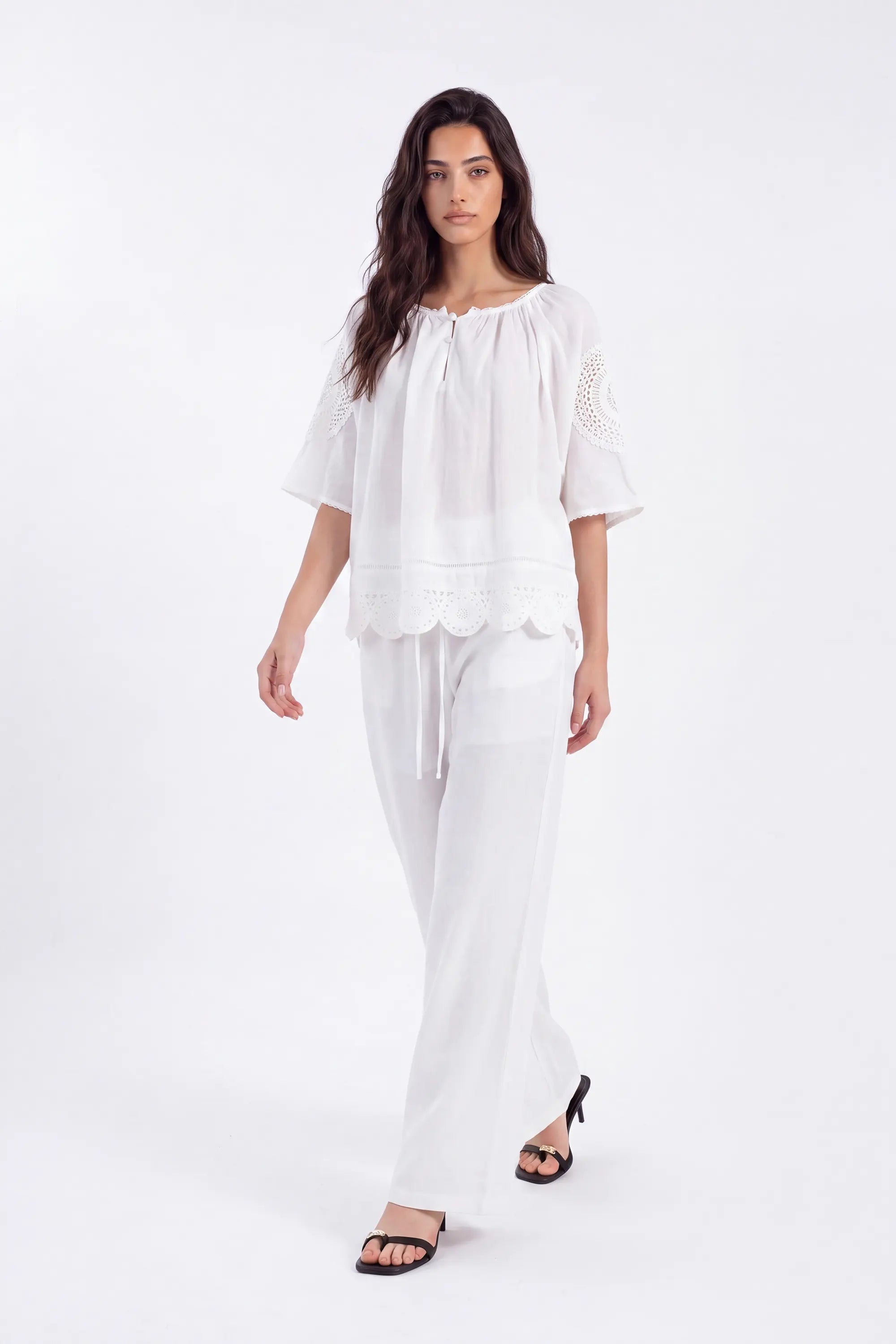 White Blouse with Crochet Lace Accents and Bell Sleeves on model, front view – Elppis 1B5E09168WW-01CM