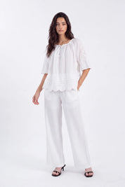 White Blouse with Crochet Lace Accents and Bell Sleeves on model, studio view 2 – Elppis 1B5E09168WW-01CM