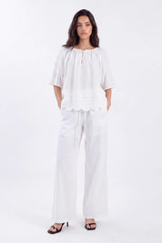 White Blouse with Crochet Lace Accents and Bell Sleeves on model, studio view 4 – Elppis 1B5E09168WW-01CM