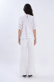 White Short-Sleeve Blouse with Cutwork Embroidery and Ruffled Hem on model, back view – Elppis 1B5E09174WW-01CM
