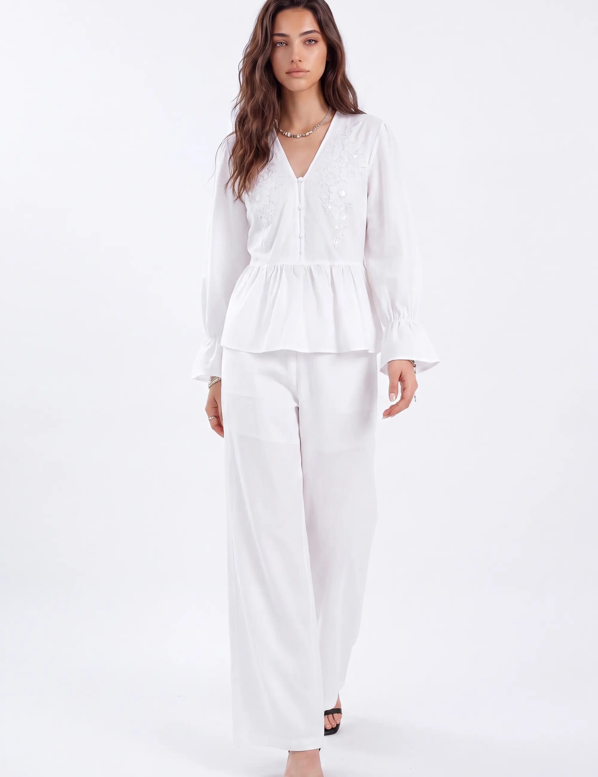 White Woven Blouse with Sequin Embroidery and Peplum Hem on model, front view – Elppis 1B5F09175WW-01CM
