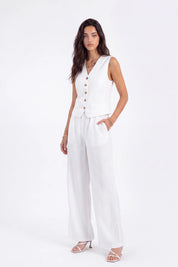 White Tailored Button-Front Sleeveless Vest on model, studio view 2 – Elppis 2B5D05442WW