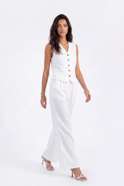 White Tailored Button-Front Sleeveless Vest on model, studio view 4 – Elppis 2B5D05442WW