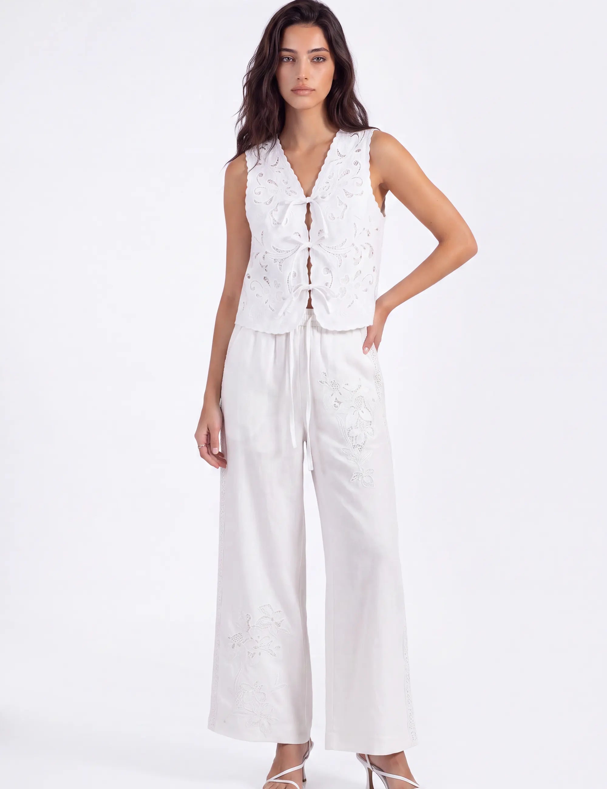White Floral Lace Cropped Vest with Tie Detail on model, studio view 2 – Elppis 2B5D07666WW