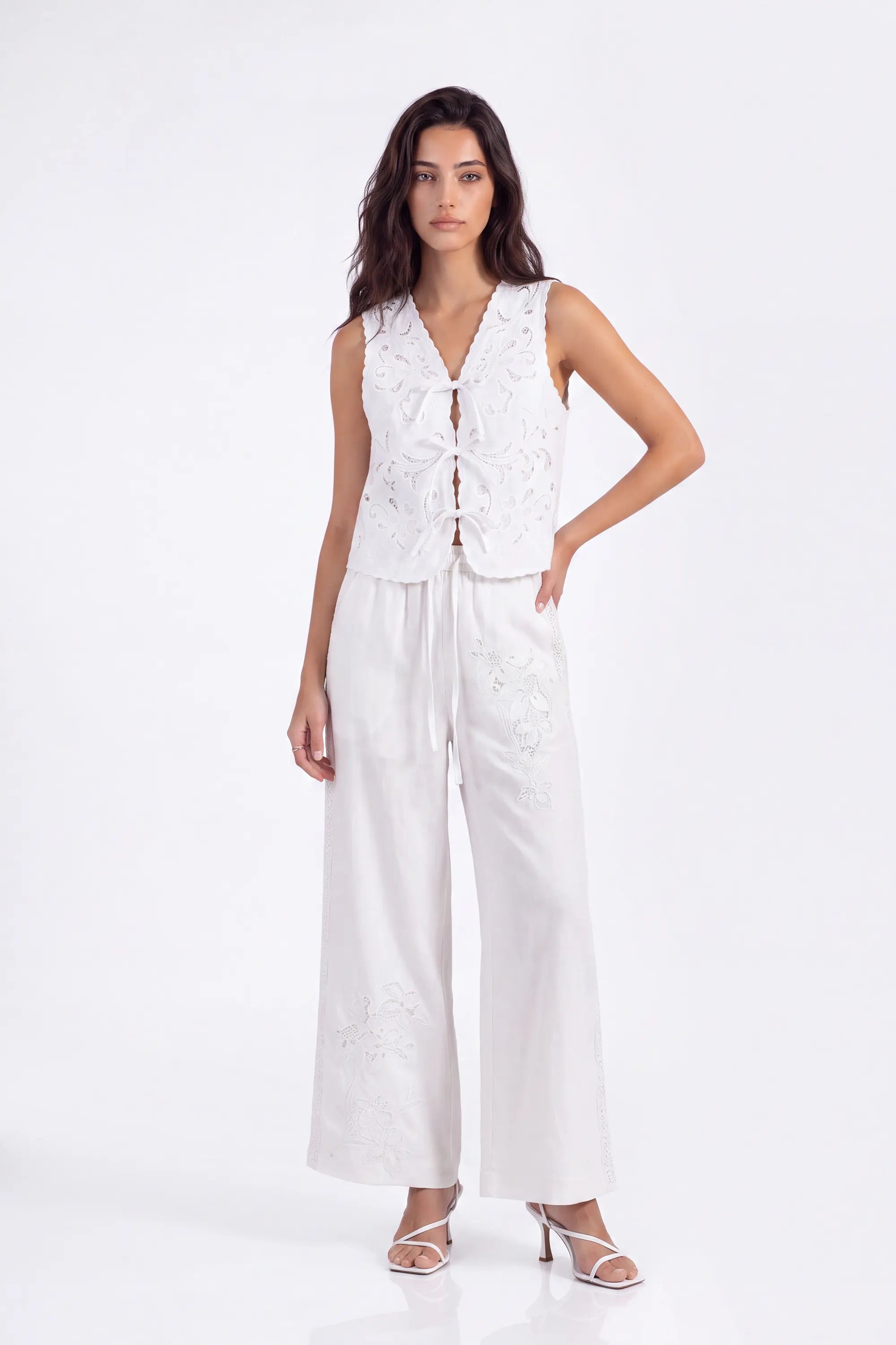 White Floral Lace Cropped Vest with Tie Detail on model, studio view 2 – Elppis 2B5D07666WW