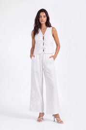 White Floral Lace Cropped Vest with Tie Detail on model, studio view 3 – Elppis 2B5D07666WW