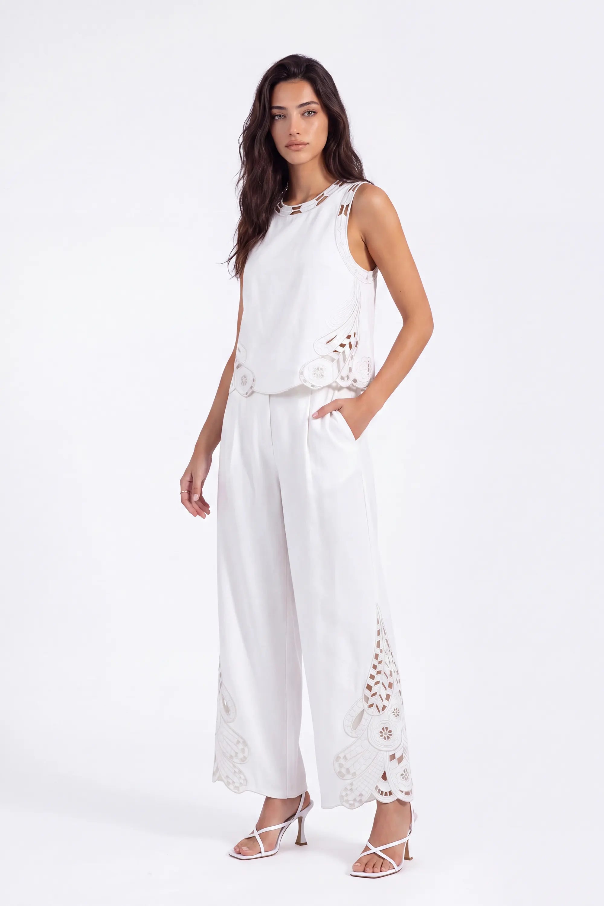 White Sleeveless Top with Cutout Embroidery Detail on model, front view – Elppis 2B5D08021WW
