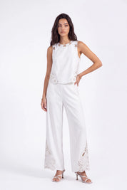 White Sleeveless Top with Cutout Embroidery Detail on model, studio view 3 – Elppis 2B5D08021WW