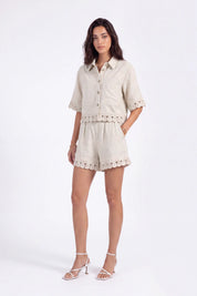 Beige Embroidered Shorts with Loop-Trim Hem on model, studio view 2 – Elppis 2J5G01499JJ