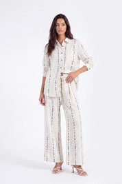Cream Polyester Wide-Leg Pants with Black Dot Stripes on model, studio view 3 – Elppis 3B5I07511WW