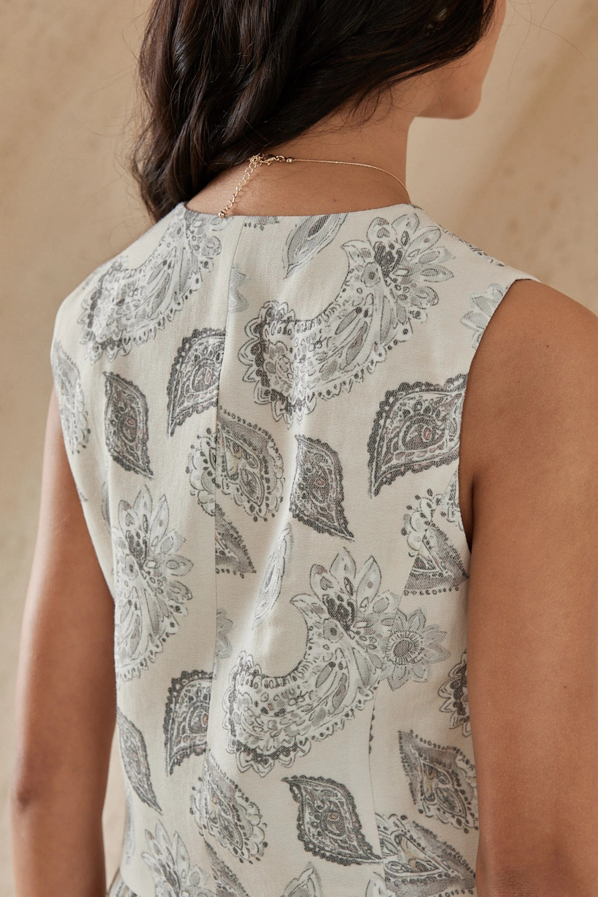 Elppis Beige Paisley Print Button-Front Sleeveless Vest, editorial styling view on model — SKU 1J6D12455BR