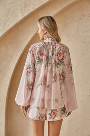 Back view of the Elppis blush pink chiffon blouse with floral print