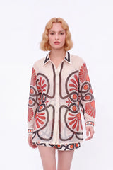 Cream High-Waisted Shorts with Red and Black Geometric Print and Buckle Belt