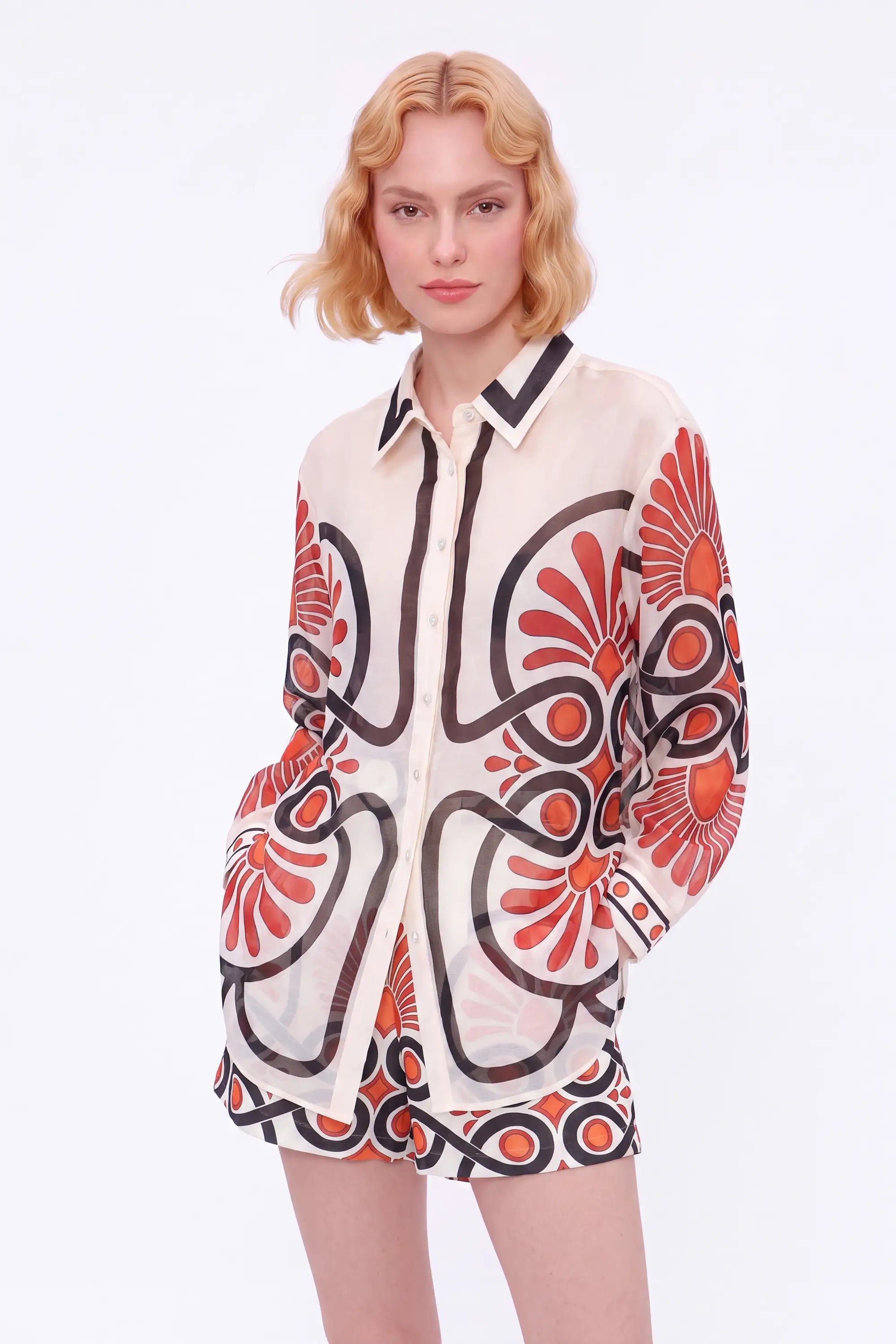 Cream High-Waisted Shorts with Red and Black Geometric Print and Buckle Belt — model front view 2