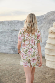 Back view of Elppis floral eyelet lace high-waisted shorts