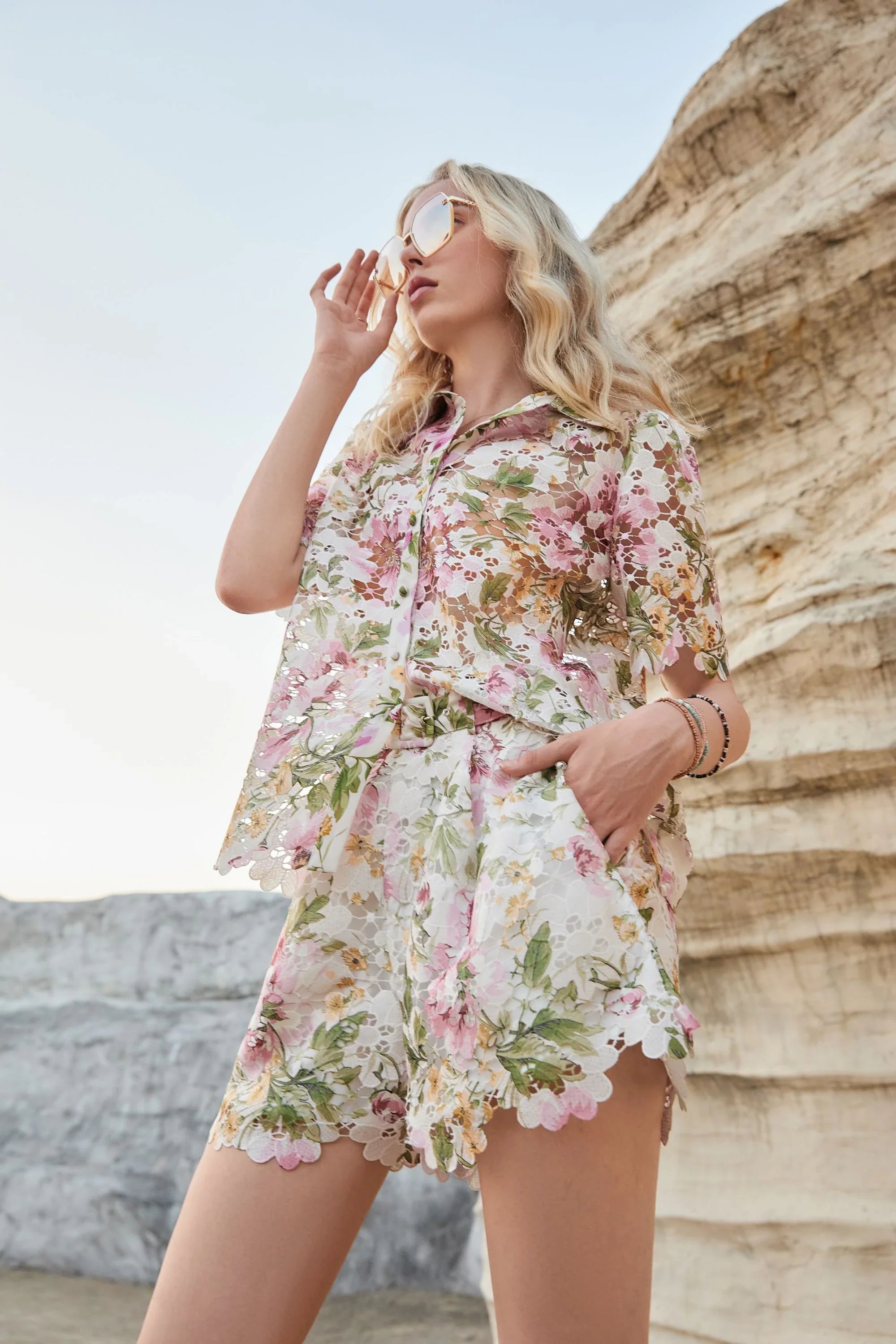 Lifestyle view of Elppis floral eyelet lace shorts with scalloped trim