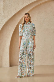 Lifestyle side view of Elppis floral lace wide-leg pants