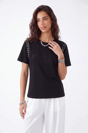 Black Crew Neck T-Shirt with Studded Shoulders and PLEIN Embroidery on model, studio view 2 – Elppis JD3E5410AV