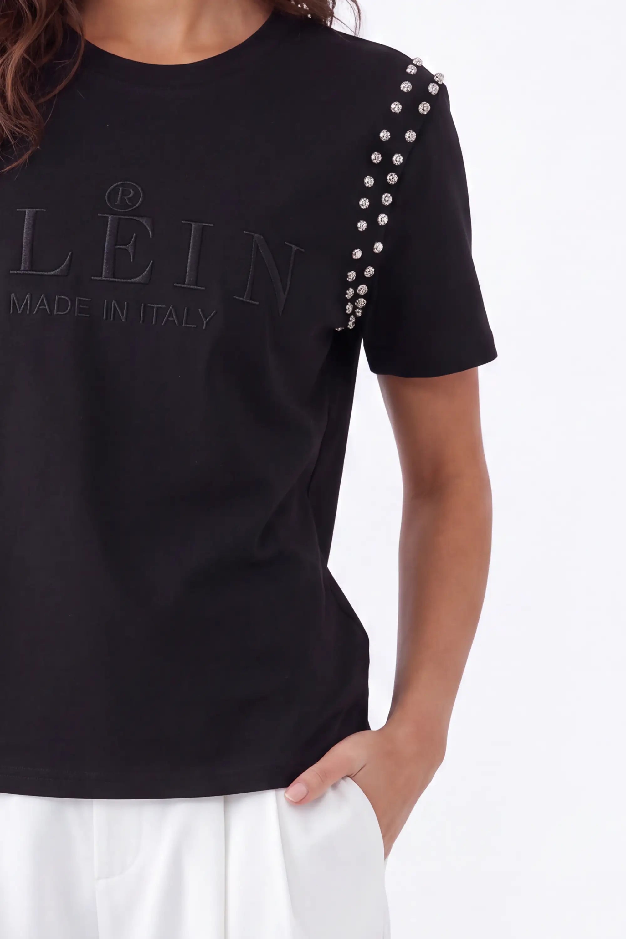 Black Crew Neck T-Shirt with Studded Shoulders and PLEIN Embroidery on model, studio view 4 – Elppis JD3E5410AV