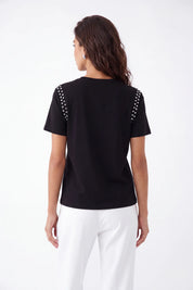 Black Crew Neck T-Shirt with Studded Shoulders and PLEIN Embroidery on model, studio view 5 – Elppis JD3E5410AV