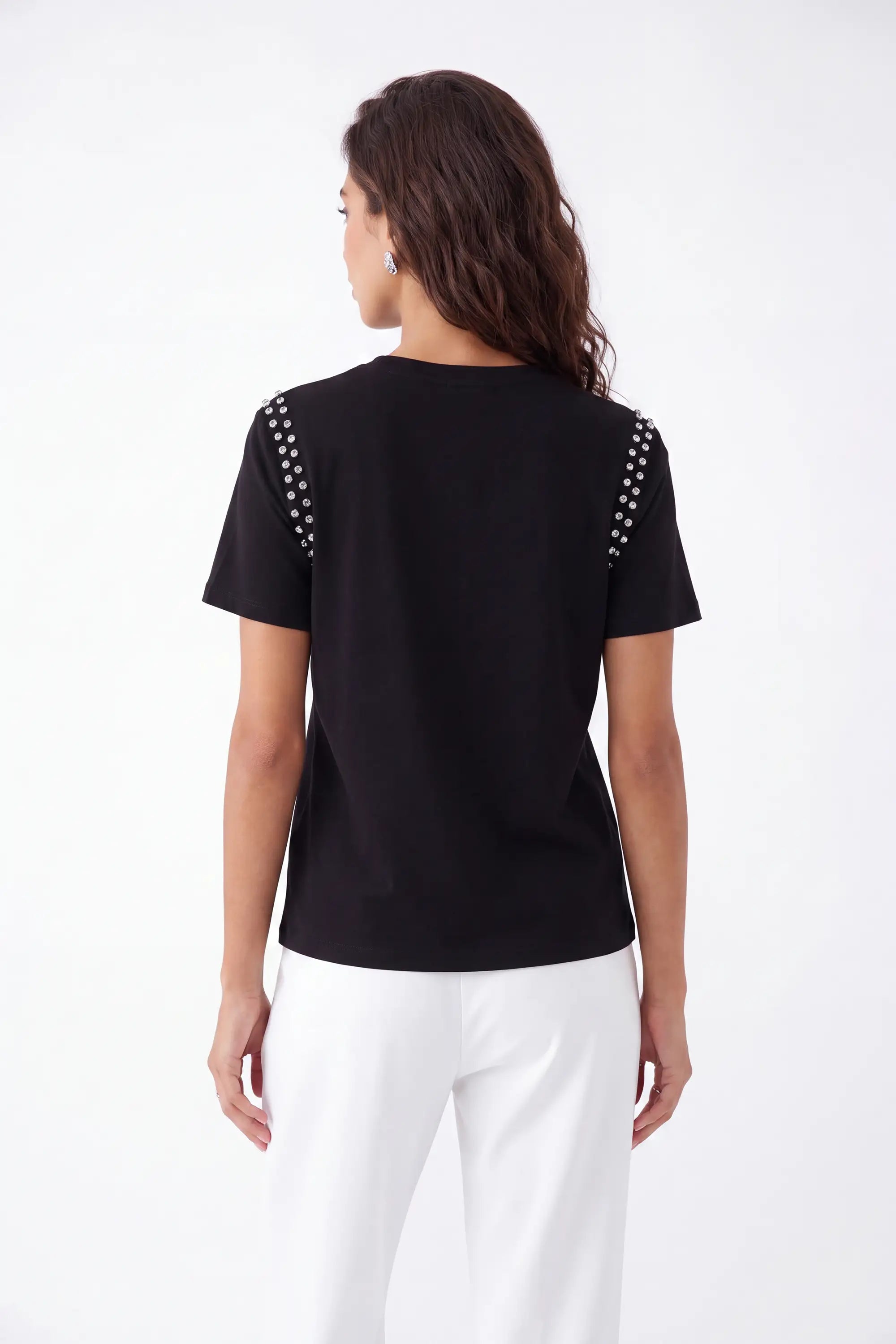 Black Crew Neck T-Shirt with Studded Shoulders and PLEIN Embroidery on model, studio view 5 – Elppis JD3E5410AV