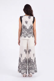 Ivory Wide-Leg Pants with Black Lace Floral Border Print on model, back view – Elppis JD4I7642BO