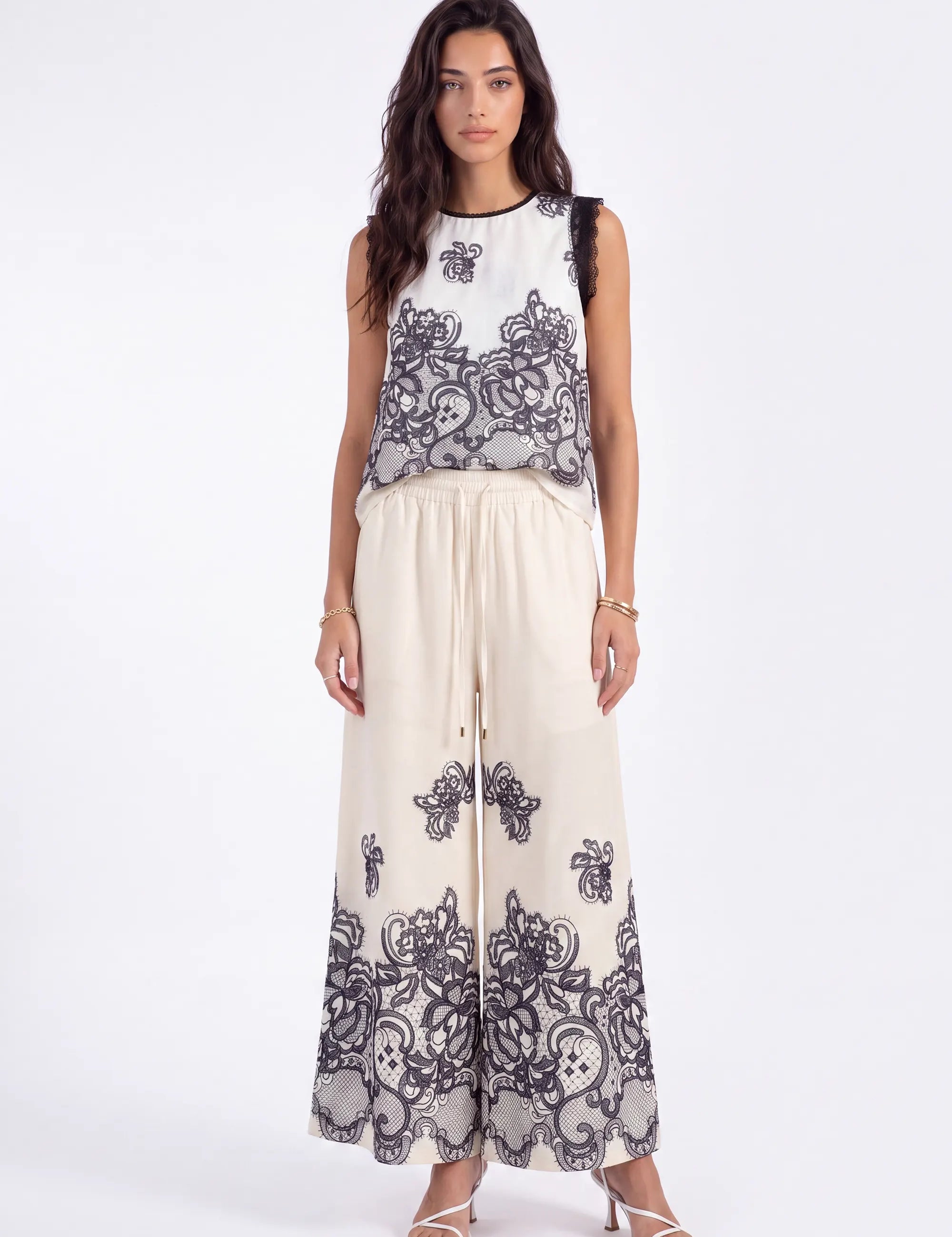 Ivory Wide-Leg Pants with Black Lace Floral Border Print on model, studio view 2 – Elppis JD4I7642BO