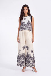 Ivory Wide-Leg Pants with Black Lace Floral Border Print on model, studio view 2 – Elppis JD4I7642BO