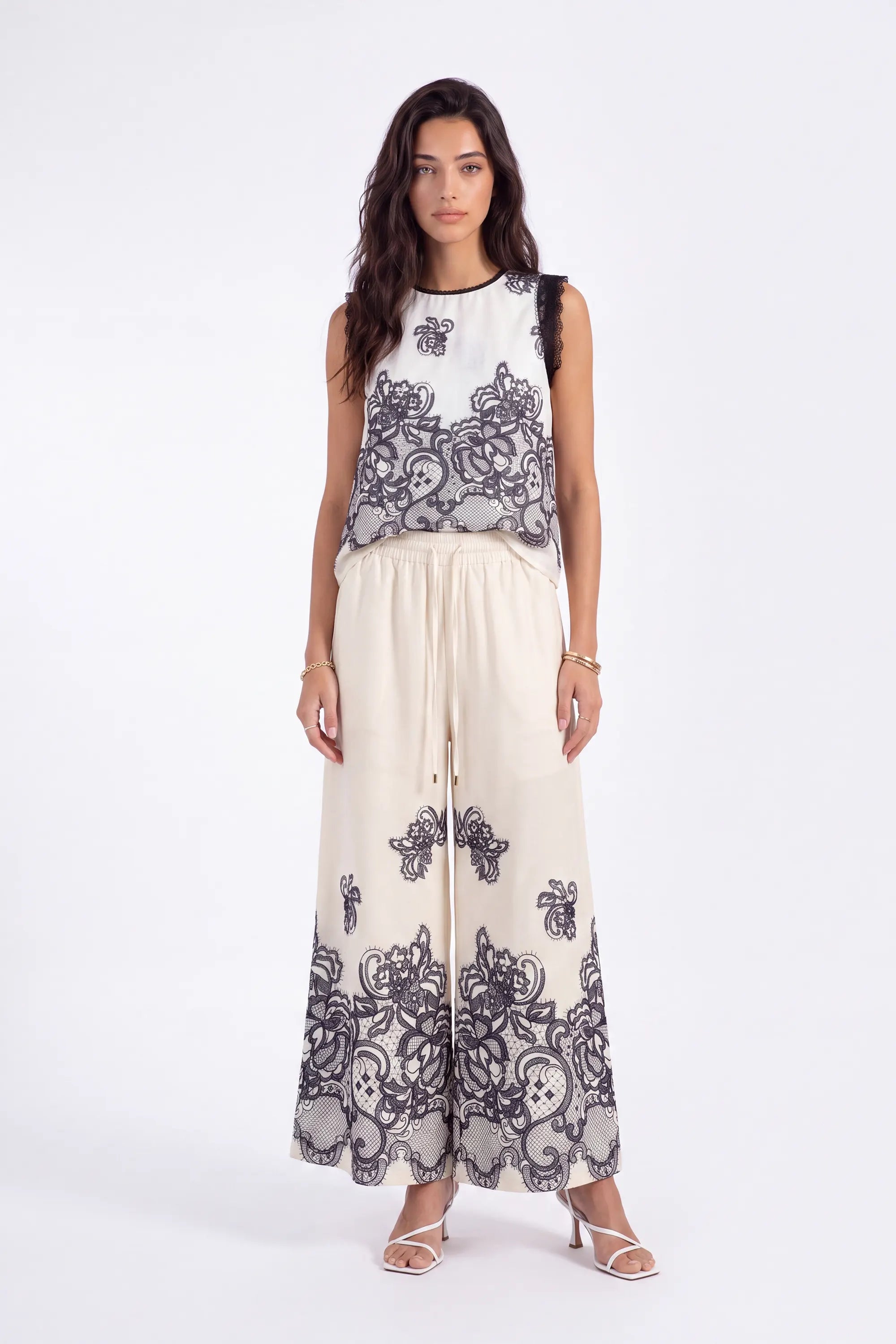 Ivory Wide-Leg Pants with Black Lace Floral Border Print on model, studio view 2 – Elppis JD4I7642BO