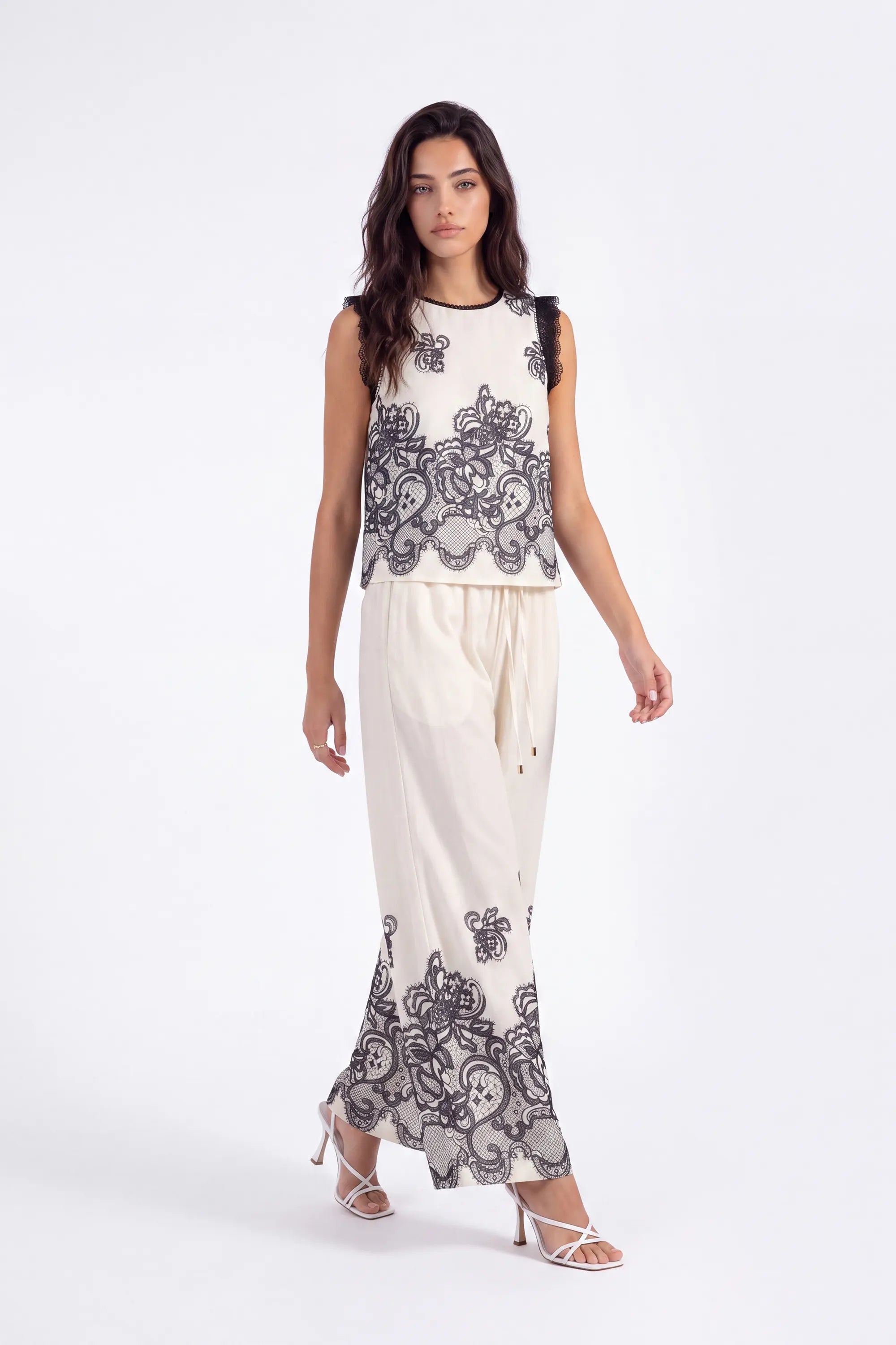 Ivory Wide-Leg Pants with Black Lace Floral Border Print on model, studio view 3 – Elppis JD4I7642BO