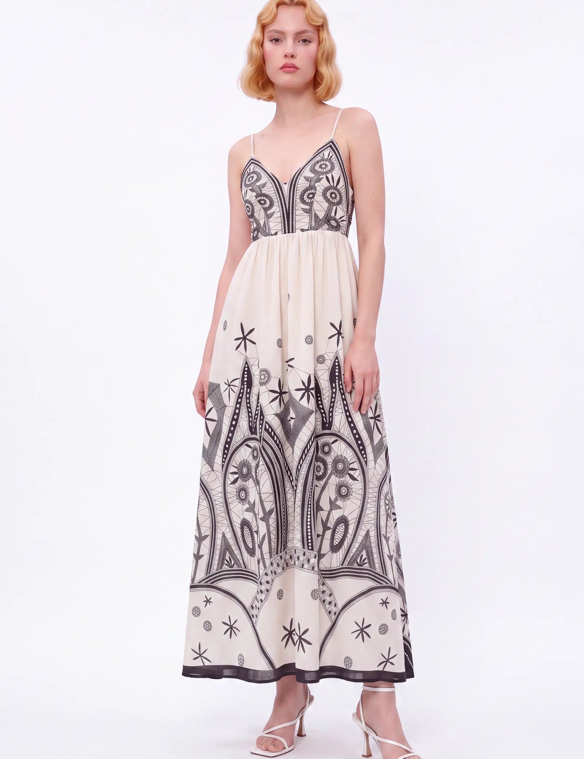 Off-White Sleeveless Maxi Dress with Black Ethnic Embroidery — Model White Background View 2