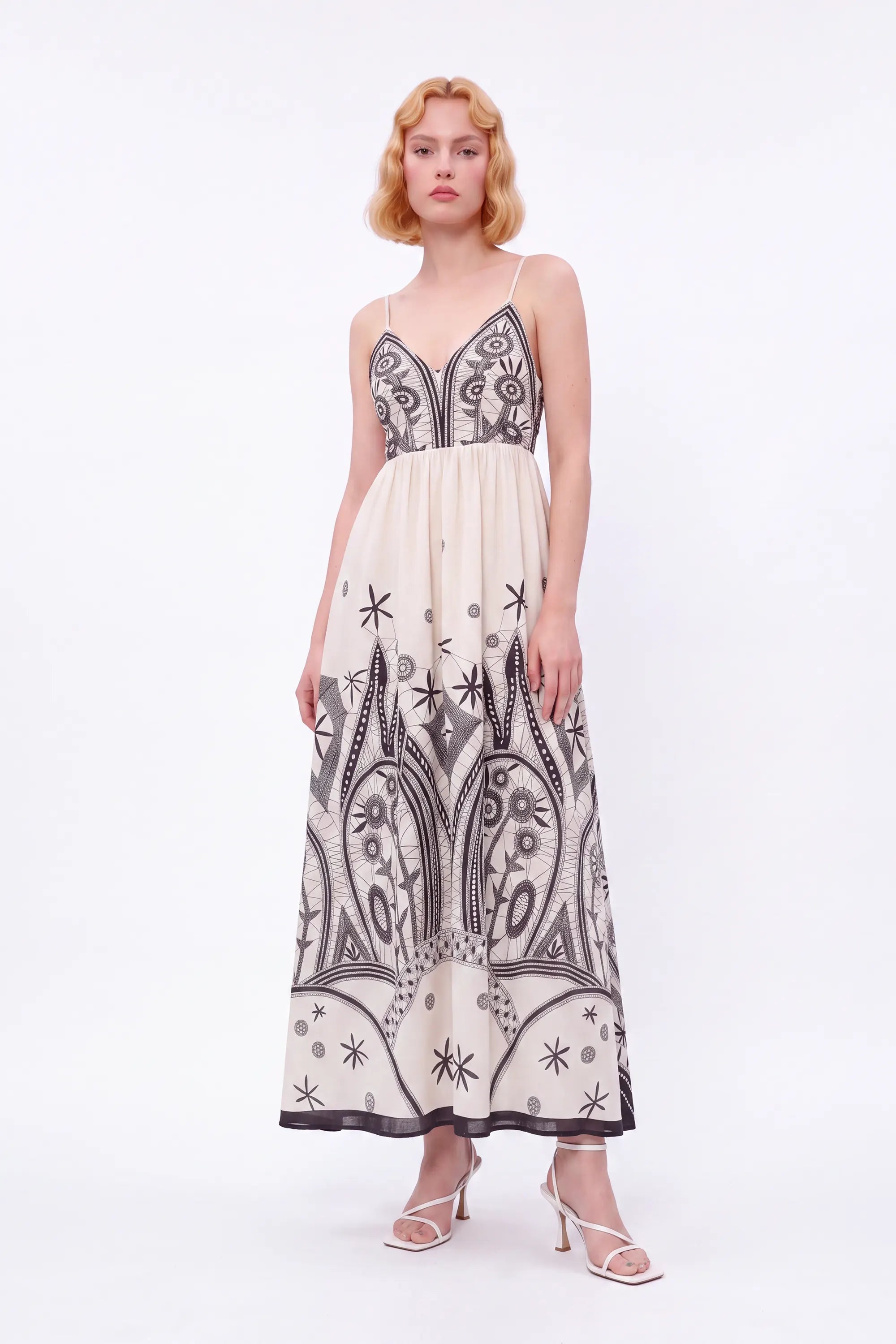 Off-White Sleeveless Maxi Dress with Black Ethnic Embroidery — Model White Background View 2