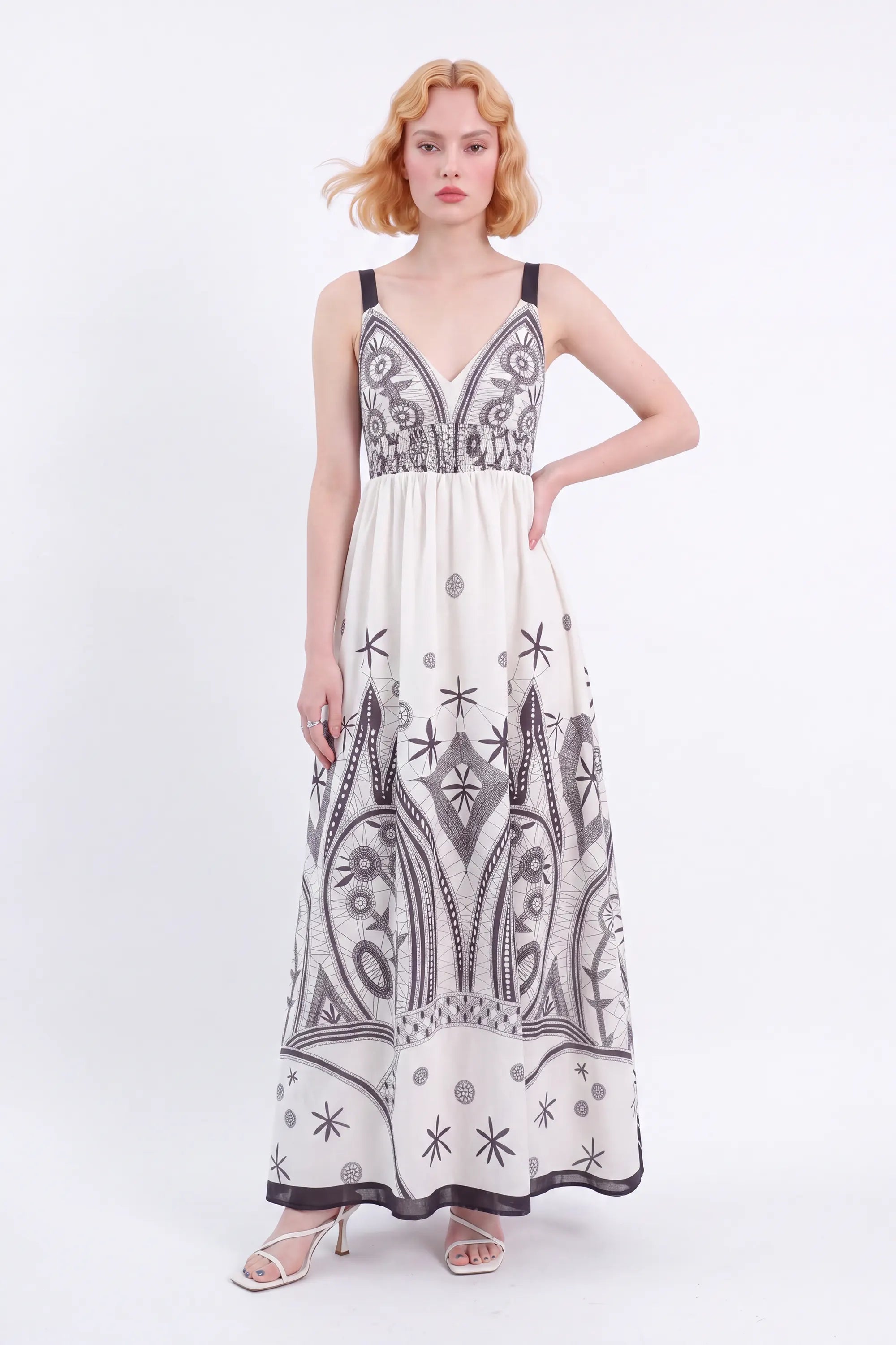 Off-White Sleeveless Maxi Dress with Black Ethnic Embroidery — Model White Background View 3