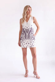 Off-White Sleeveless Shift Dress with Black Ethnic Pattern — Model White Background View 3